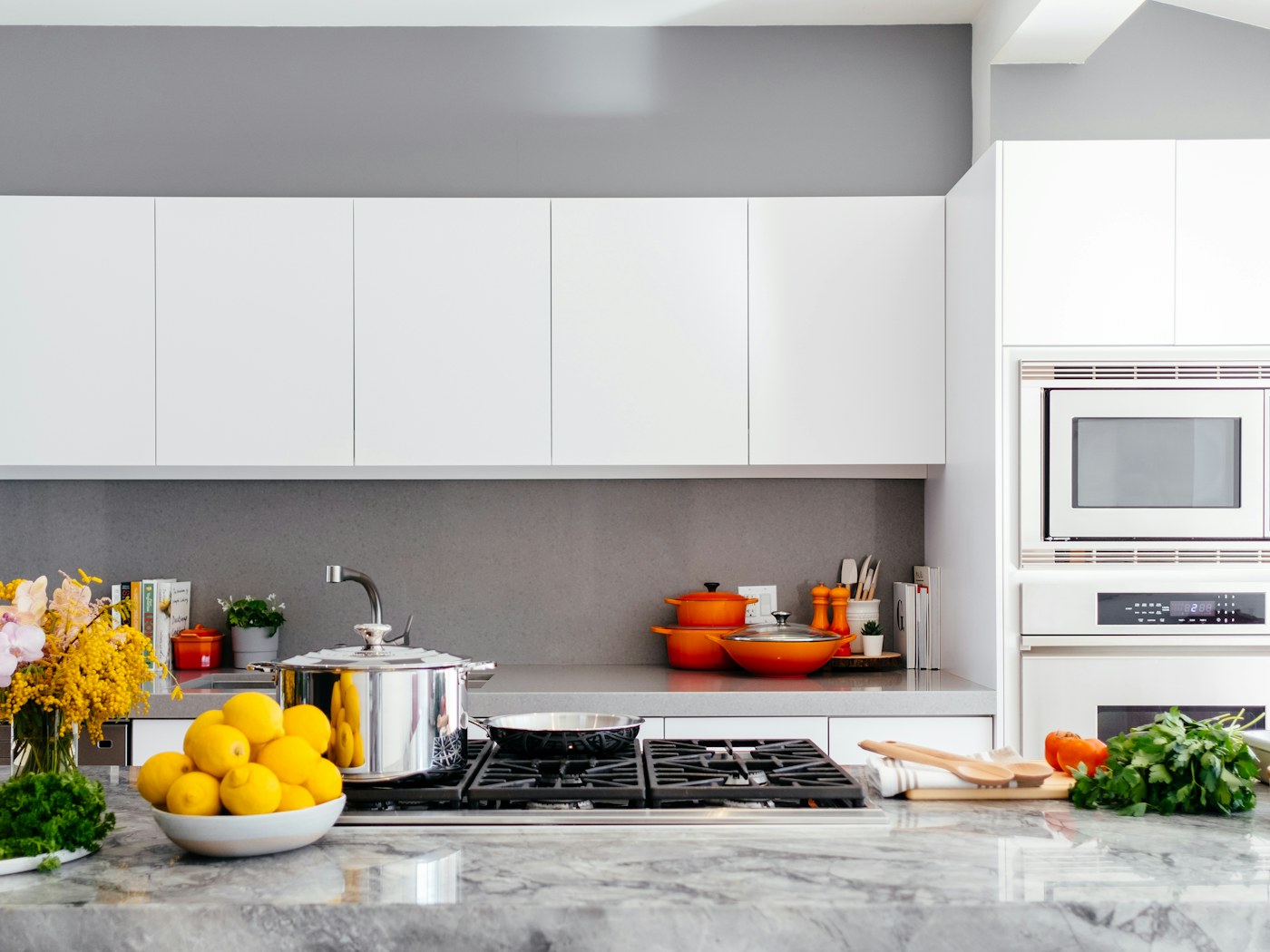 Open kitchen shelves with neatly arranged jars and everyday pantry staples