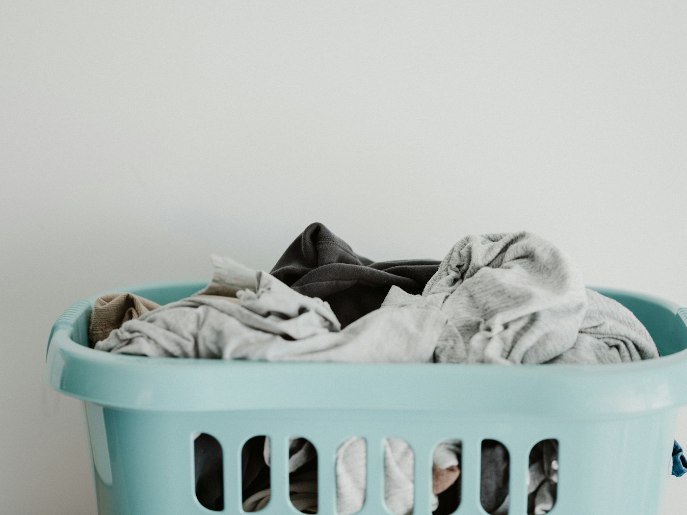 Neat linen closet with folded towels and labeled household backstock