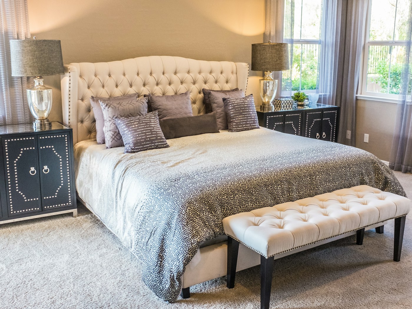 Calm bedroom with layered pillows and rumpled everyday bedding