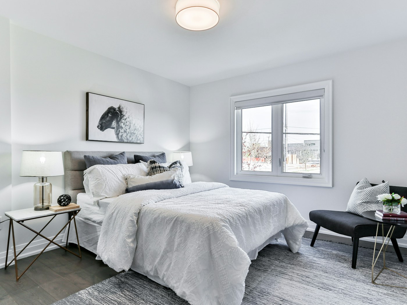 Bedroom with shallow lidded storage boxes sliding under the bed